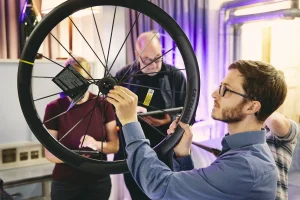 Man holding carbon road bike wheel at Eurobike
